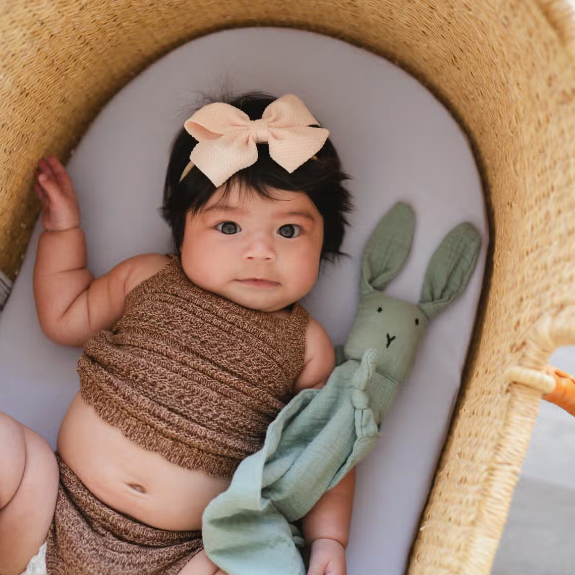 Baby girl with the Bunny Lovey Blanket in Green